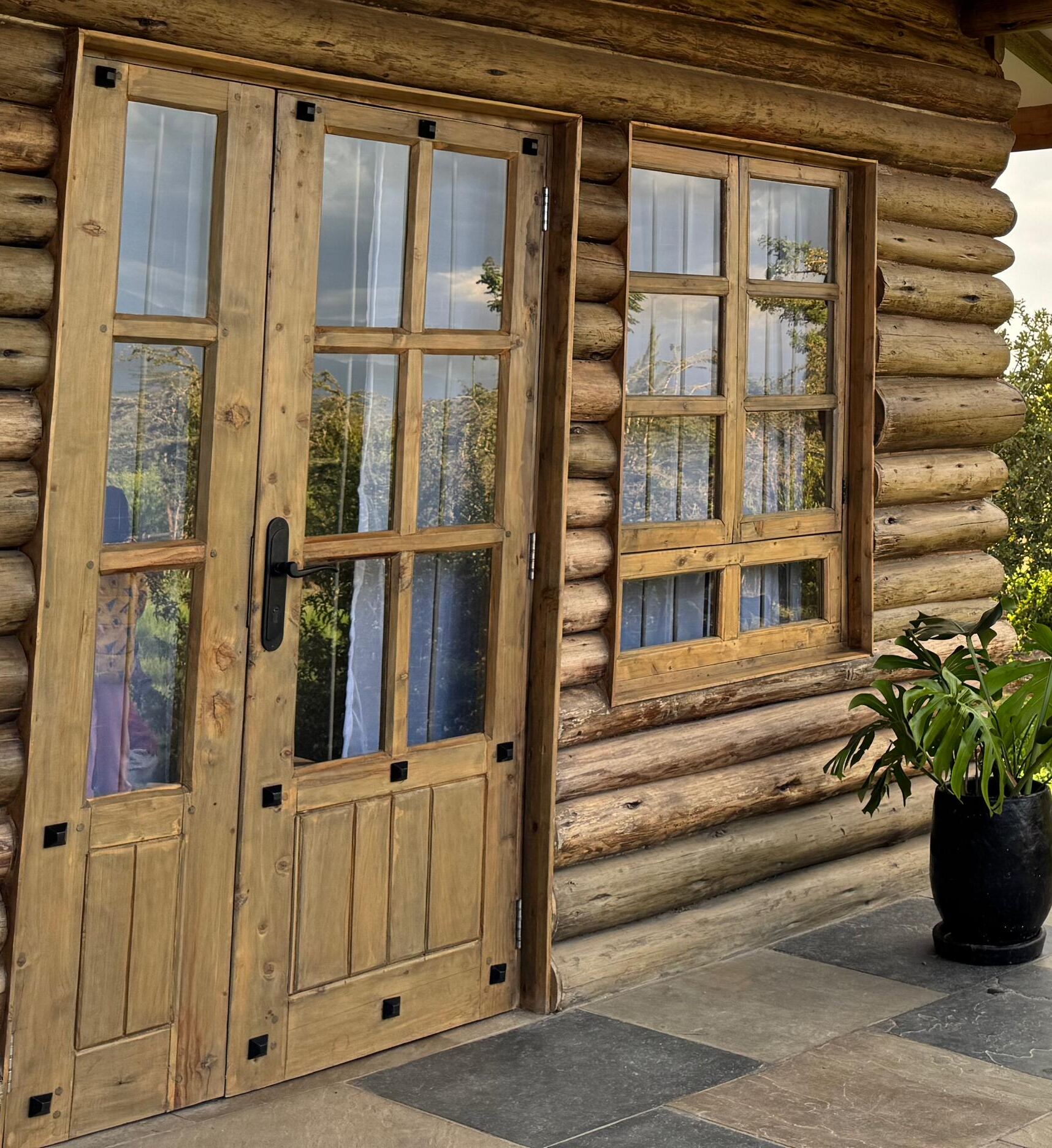 Timber double doors of the log cabin