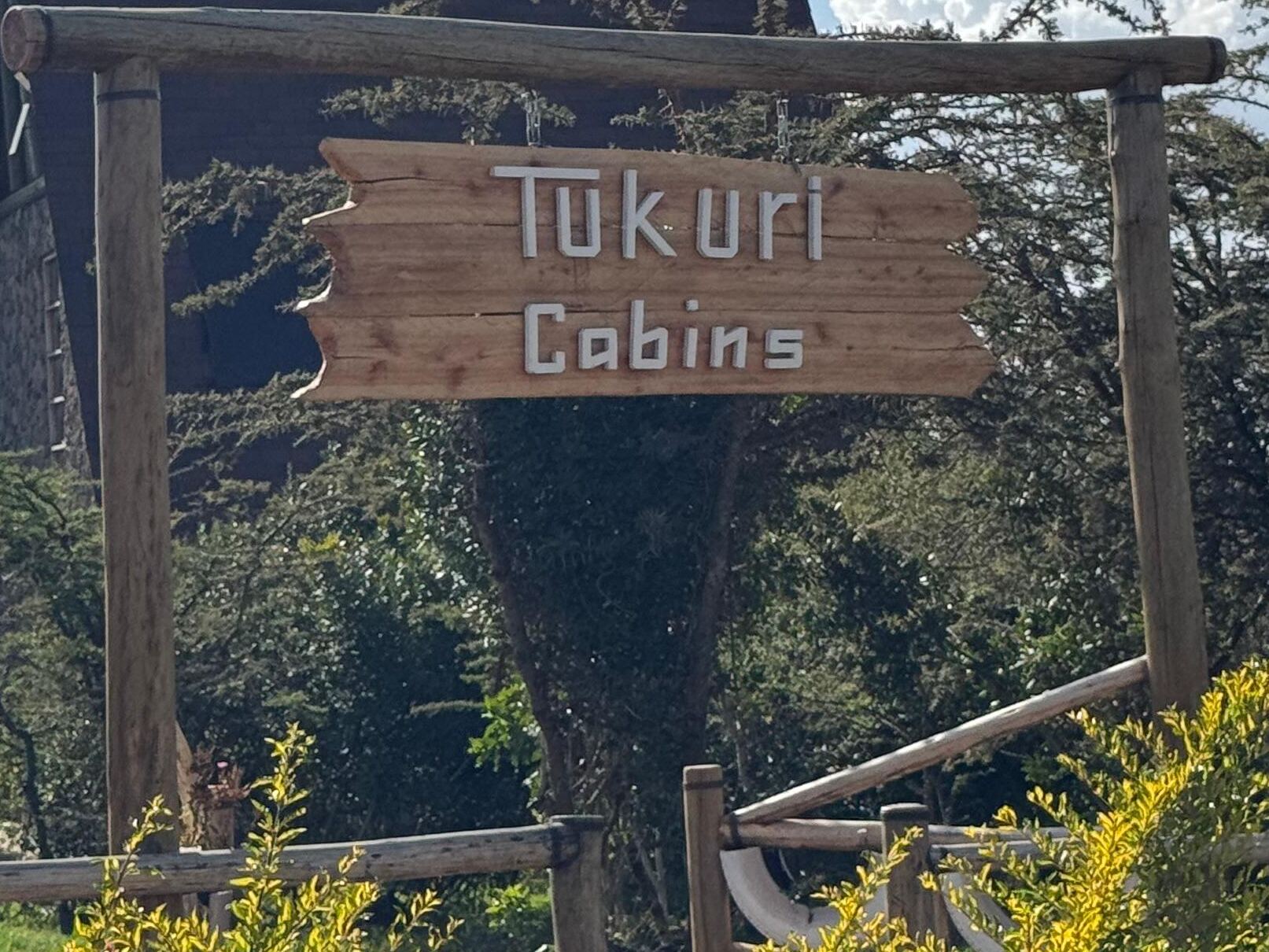 Hand-carved Tukuri Cabins sign